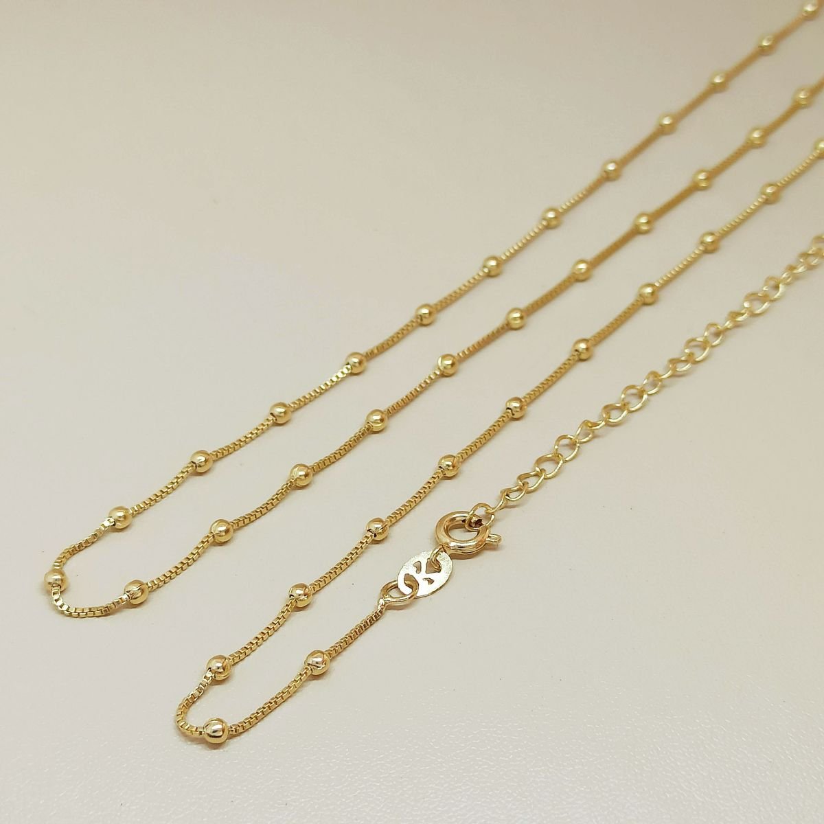 Corrente folheada a ouro com bolinhas 35+10cm 3mm